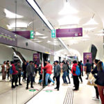 Doha metro passengers boarding a train at Msheireb metro station.