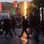 Visitors to the Strip cross Las Vegas Boulevard in November 2022 in Las Vegas. (Ellen Schmidt/L ...