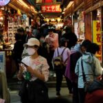 Turistas chinos regresan con carteras más ligeras
