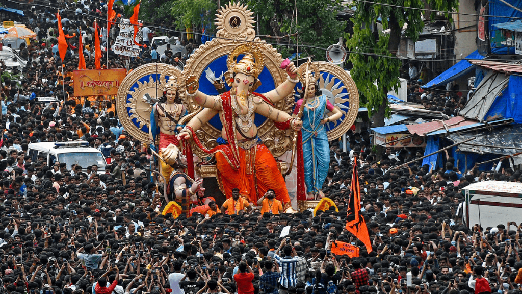 Devotees carry the idol of Lord Ganesha to be installed at a pandal ahead of the Ganesh Chaturthi festival in Mumbai