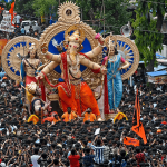 Devotees carry the idol of Lord Ganesha to be installed at a pandal ahead of the Ganesh Chaturthi festival in Mumbai