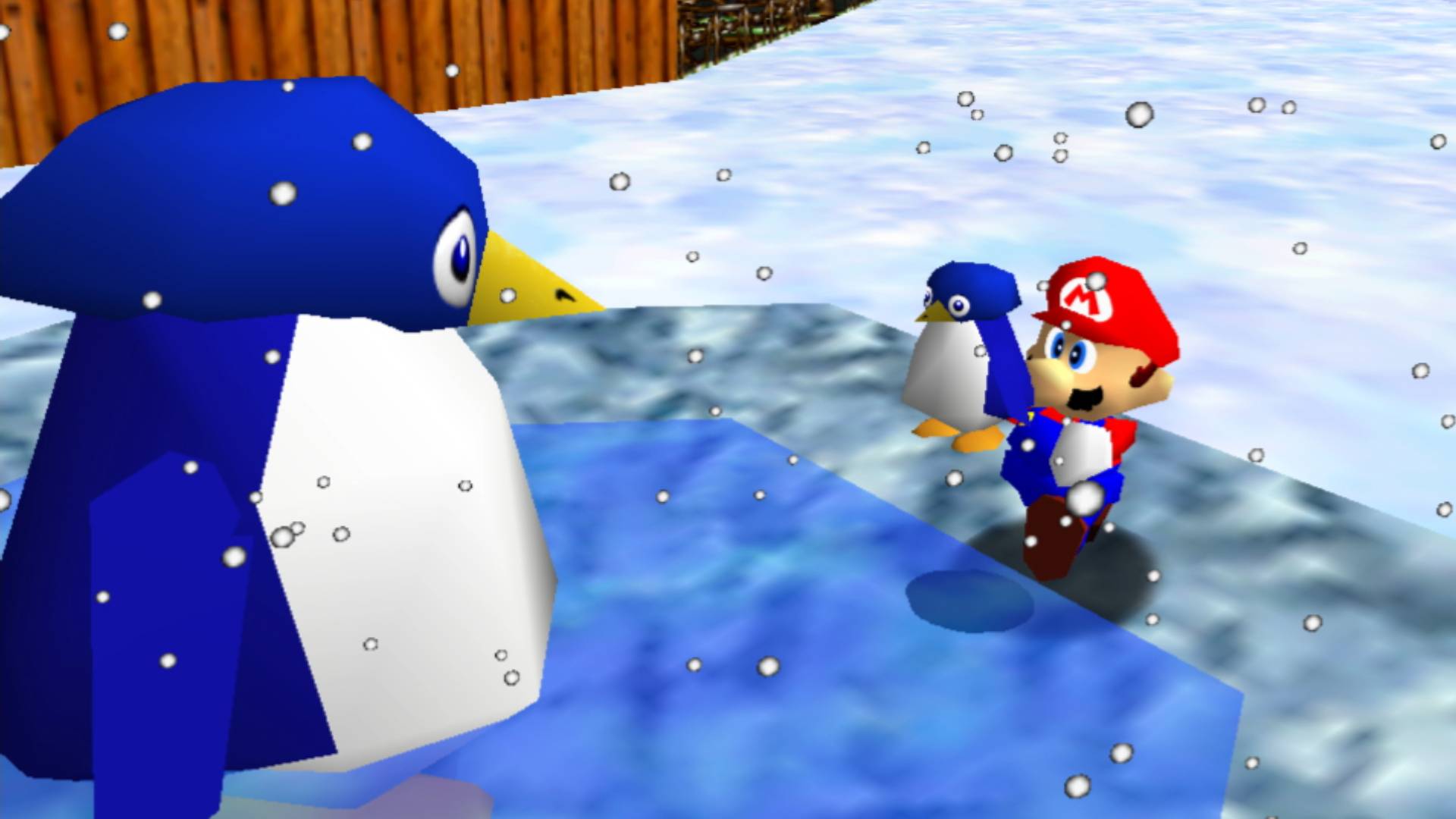 En Super Mario 3D All Stars, una captura de pantalla de Mario libera a Super Mario 64, con su madre como pingüino bebé.